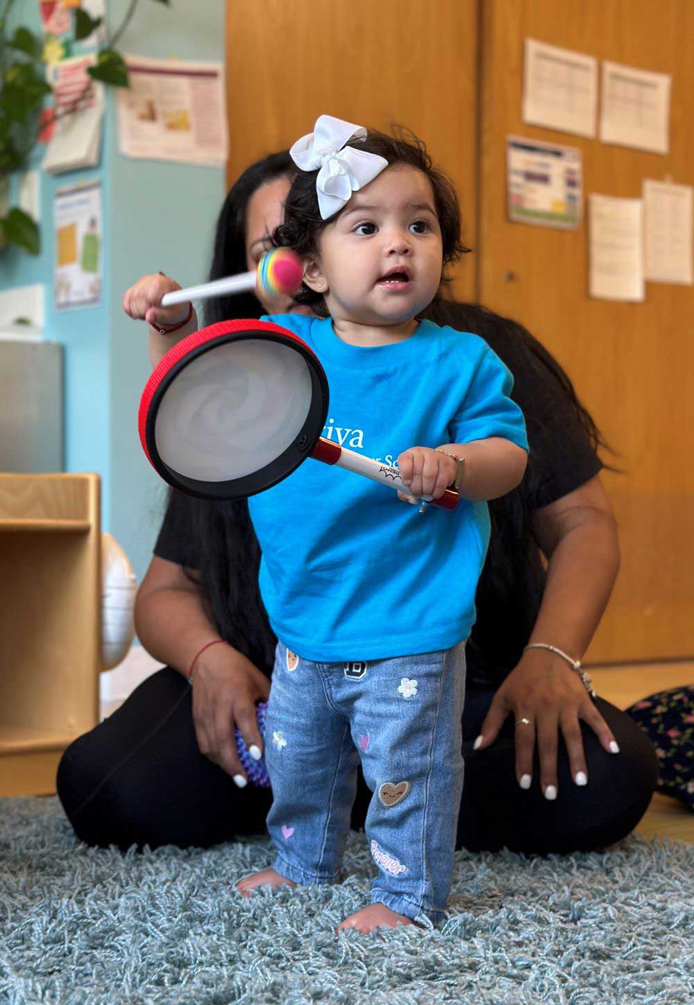 | Peter H. & Dana Gunn Winslow Foundation little girl with lollipop drum
